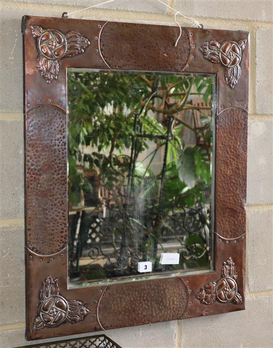 An Arts and Crafts rectangular copper framed wall mirror, W.56cm, H.69cm